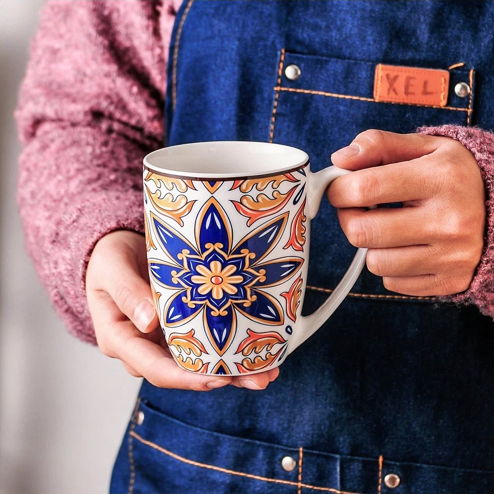 A woman is holding an elegant mug, part of a collection of porcelain dinnerware sets, showcasing its refined design and craftsmanship.