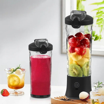 portable blender with black lid filled with fruit beside another blender cup with red smoothie on white table.