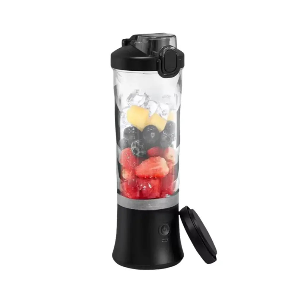 portable blender in black filled with strawberries, blueberries, pineapple, and ice, shown with detachable lid on white background.