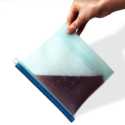 Reusable silicone steamer bags turned upside down on a kitchen counter to demonstrate their secure, leak-proof design, ensuring food stays safely inside without spilling.