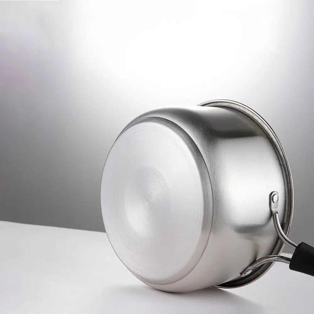 Bottom view of a stainless steel saucepan with lid, showing flat base and attached black handle on a neutral background.