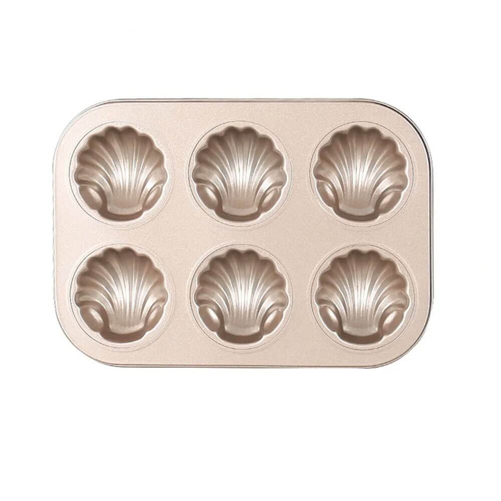 A rectangular carbon steel baking pan with six shell-shaped molds. The pan has a smooth, metallic surface and a uniform design.