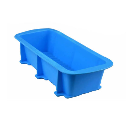 A bright blue silicon bread pan with a smooth, rectangular design and slightly ribbed interior, ideal for baking bread and loaf recipes.