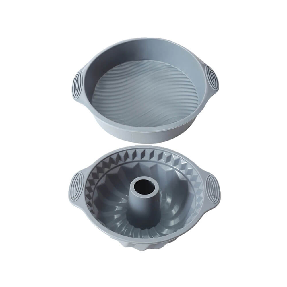 Two gray silicone baking pans, one round and one bundt-shaped, with textured interiors and side handles for easy grip.