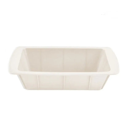 Silicone loaf pan in ivory color with a rectangular shape, deep sides, and wide handles for baking.