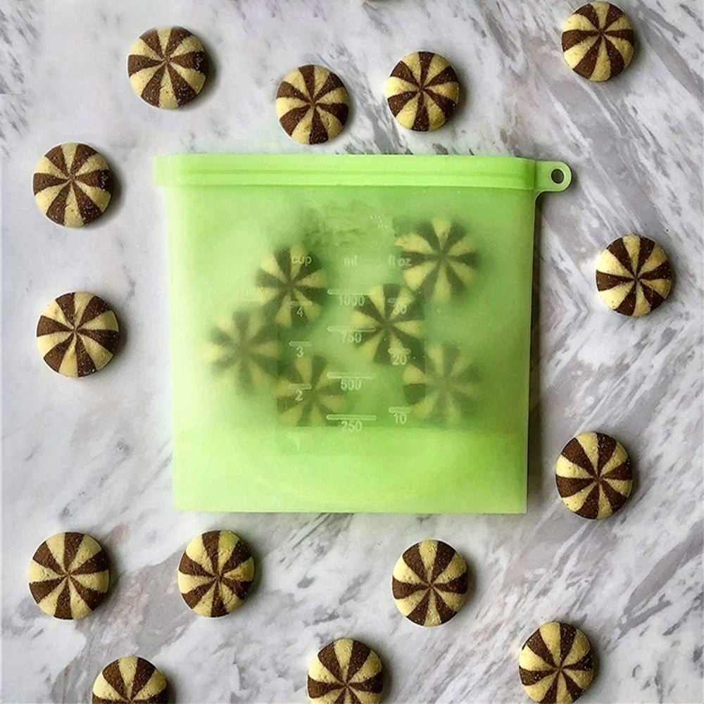 Reusable silicone bags filled with chocolate cookies, showcasing their airtight, flexible design to keep baked goods fresh and delicious.