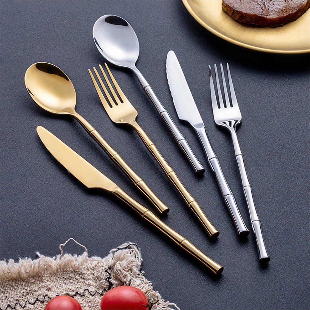 silverware stainless steel, featuring silver and gold dinner forks, soup spoons, and dinner knives.