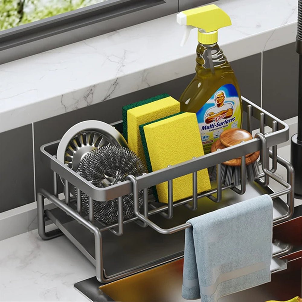 Grey kitchen sink caddy holds two sponges and dishwashing detergent, keeping your sink area organized.