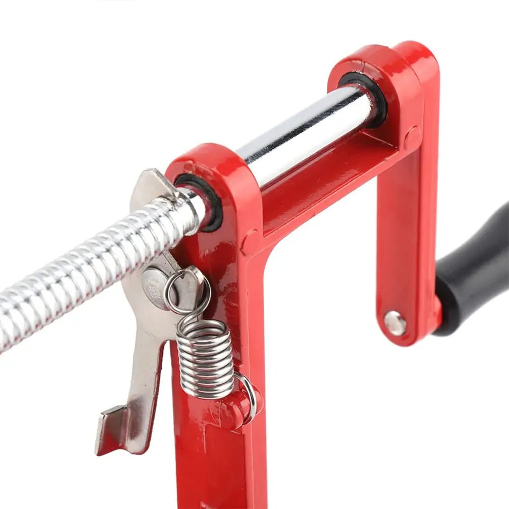 Close-up of spiralizer vegetable cutter showing red frame, chrome screw rod, and spring mechanism with black handle.