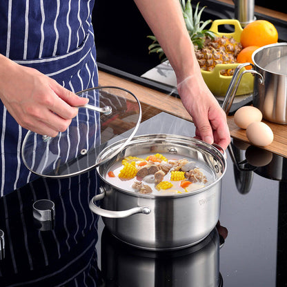 A person lifting the glass lid of a stainless steel pot filled with a colorful stew, demonstrating the practicality and style of stainless steel cookware sets non-stick for modern kitchens.