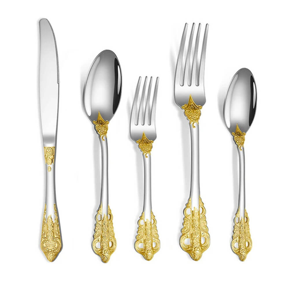 Stainless steel flatware set with ornate gold detailing. Includes dinner knife, soup spoon, salad fork, dinner fork, and teaspoon.