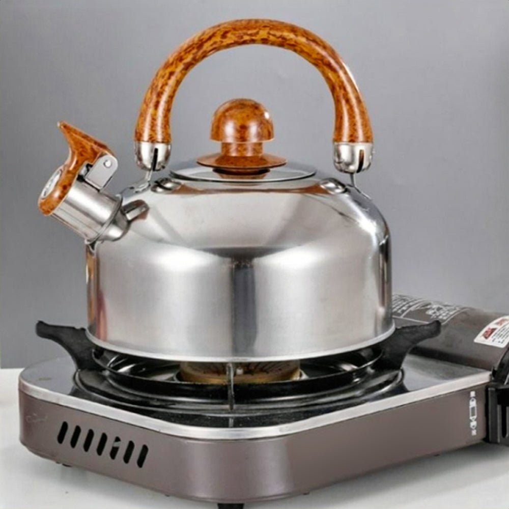 Stainless steel tea kettle on the stove, part of the stainless steel set cookware, showcasing its sleek design and durable build.