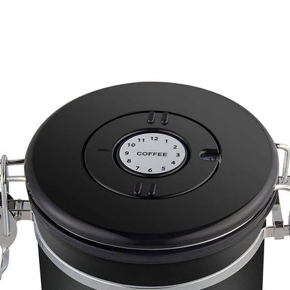 A close-up of a stainless steel storage container for food in matte black, highlighting its airtight lid with a built-in date tracker, secure latch, and silicone seal for optimal freshness preservation.