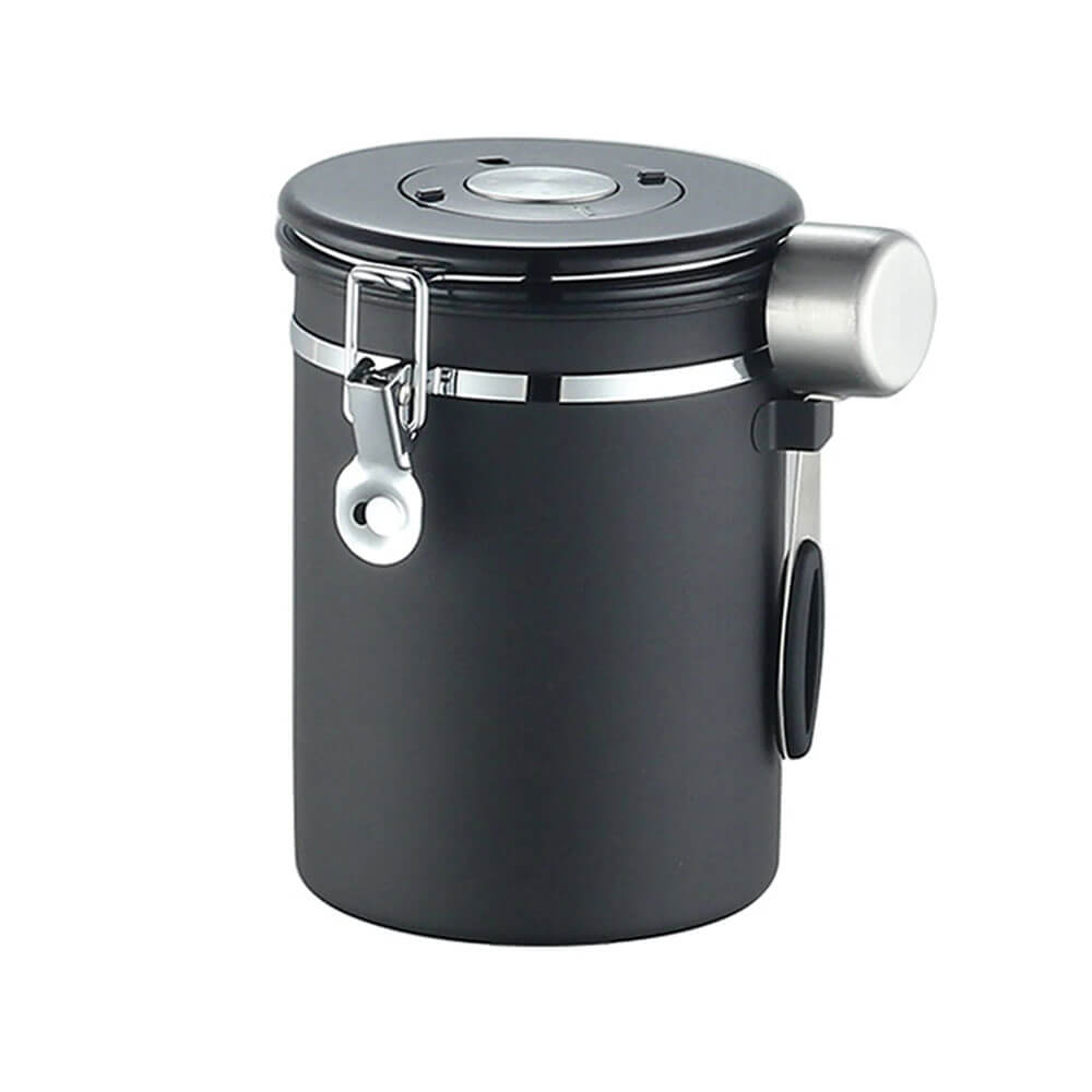 A sleek stainless steel storage container in matte black, featuring an airtight lid with a built-in date tracker, secure latch, silicone seal, and an attached stainless steel spoon, displayed on a white background.