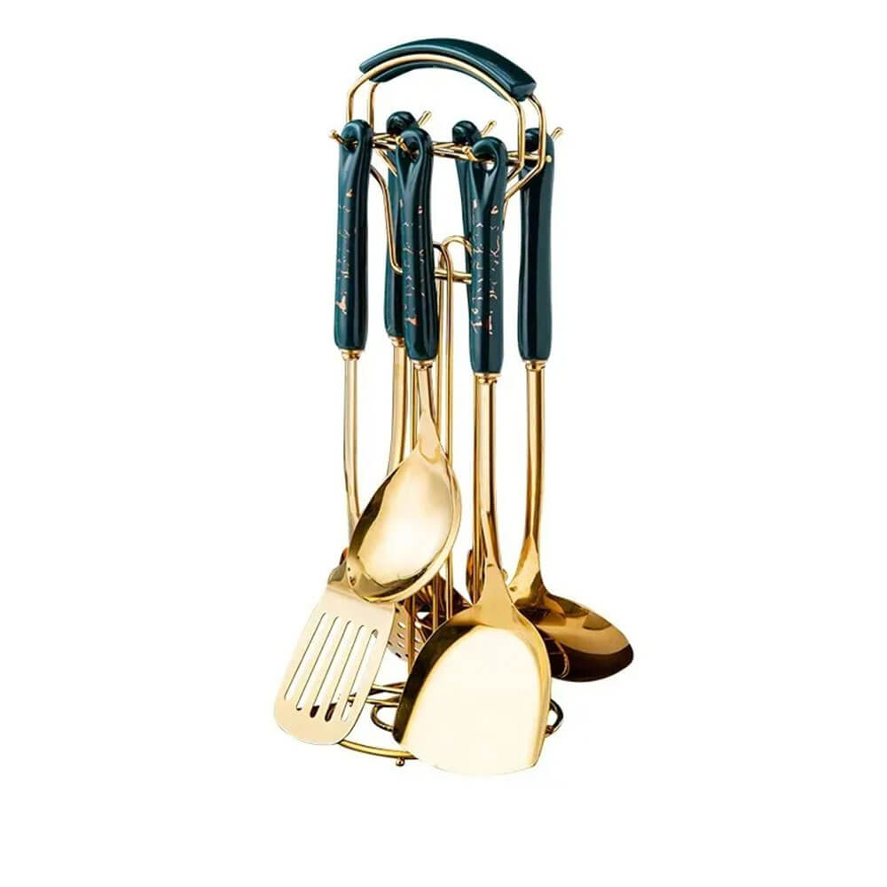 Elegant stainless-steel utensils set with gold finish and dark green handles on a matching stand.
