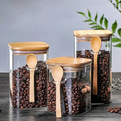 Sets of canisters for tea, coffee, and sugar storage, made from glass with bamboo lids.