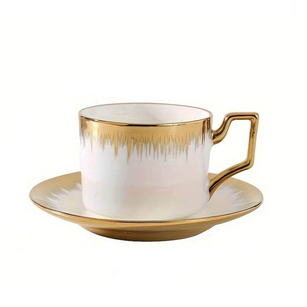 Tea cups and saucers set featuring white porcelain with luxurious gold trim and modern handle design, ideal for elegant tea service.