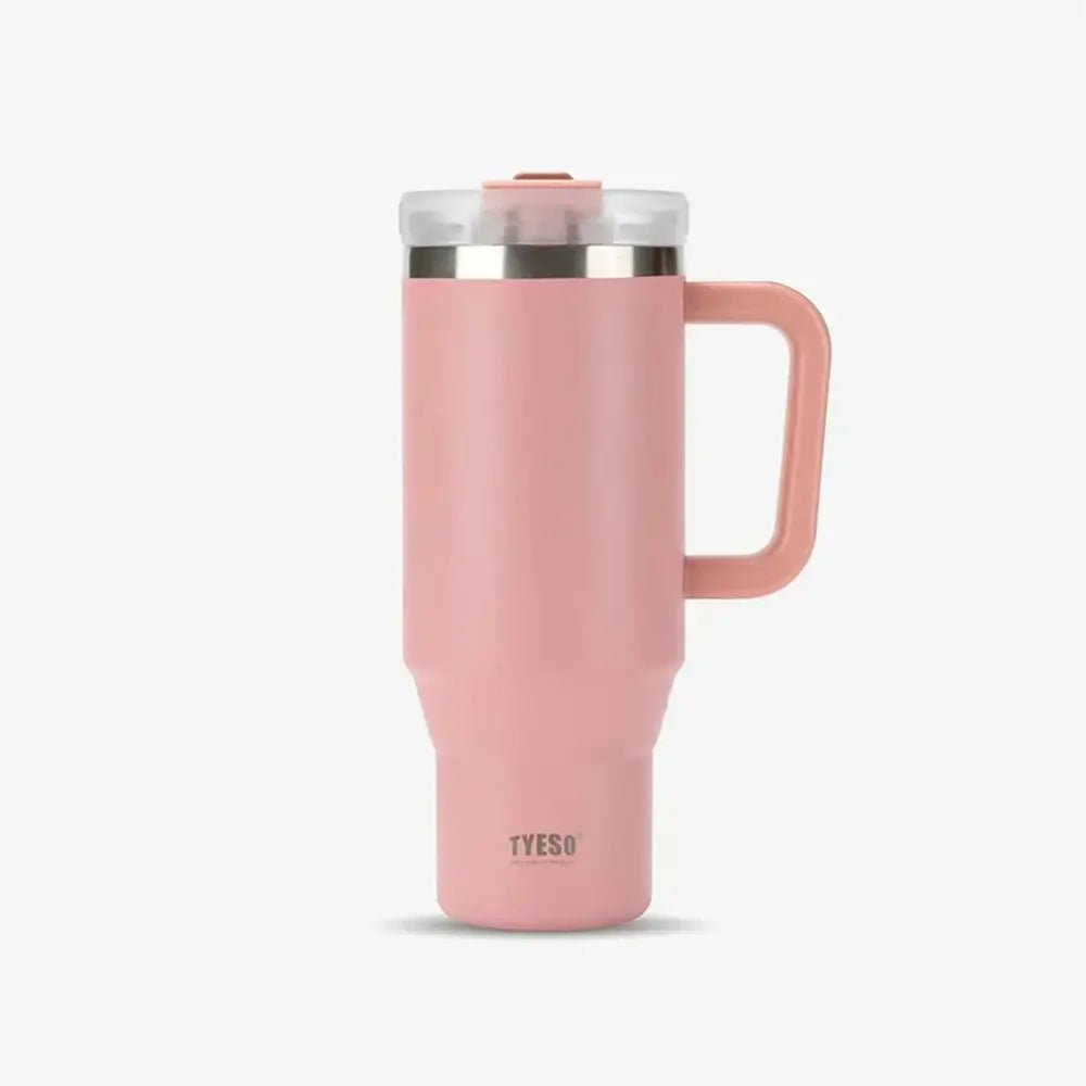 Pink TYESO thermal mug travel cup with handle and clear lid on a plain background.