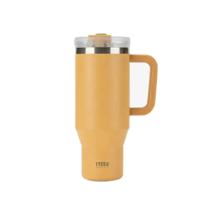 Yellow TYESO thermal travel mug with handle and clear lid on a plain background