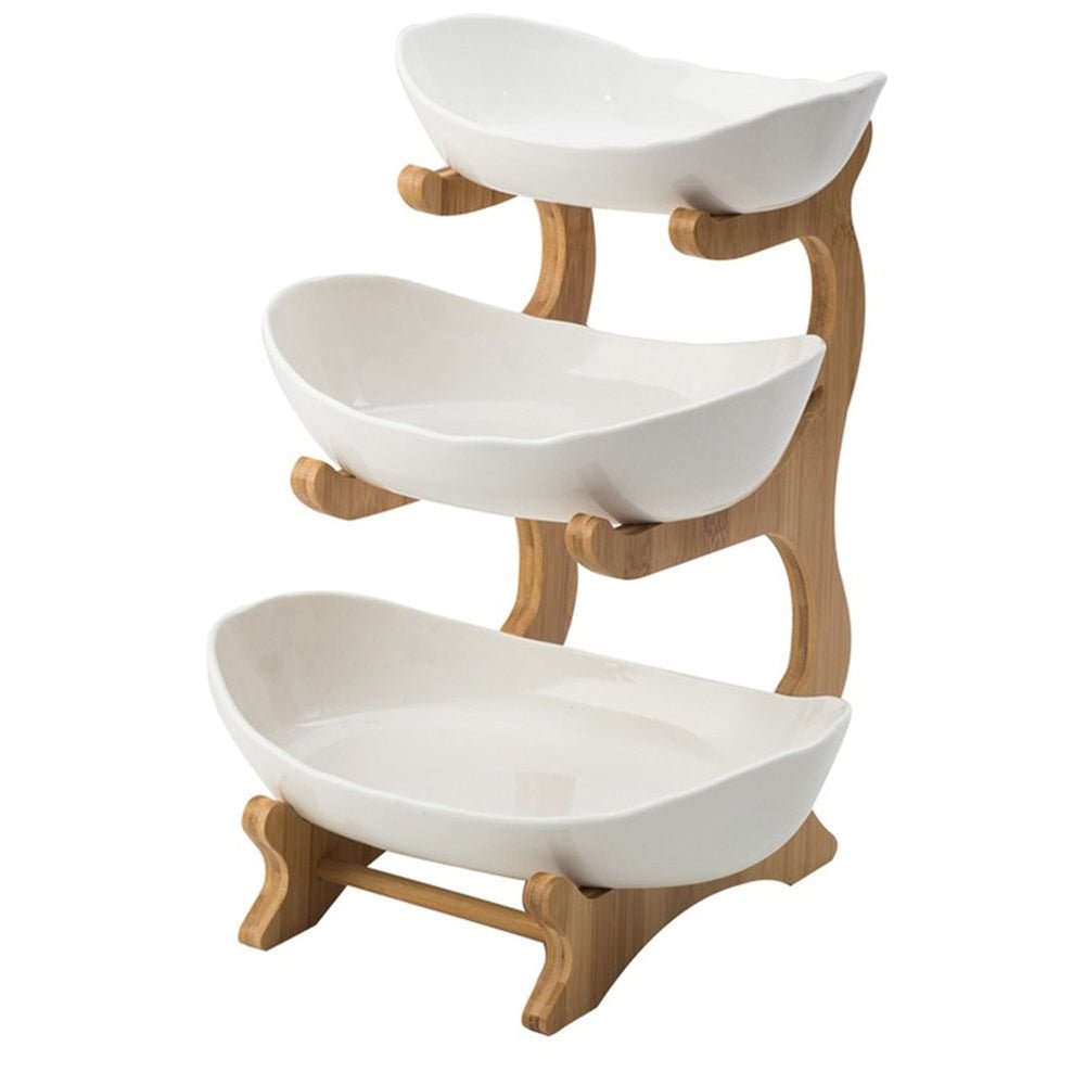 A white three-tier fruit bowl with a sleek design, featuring three levels for elegant and organized display.