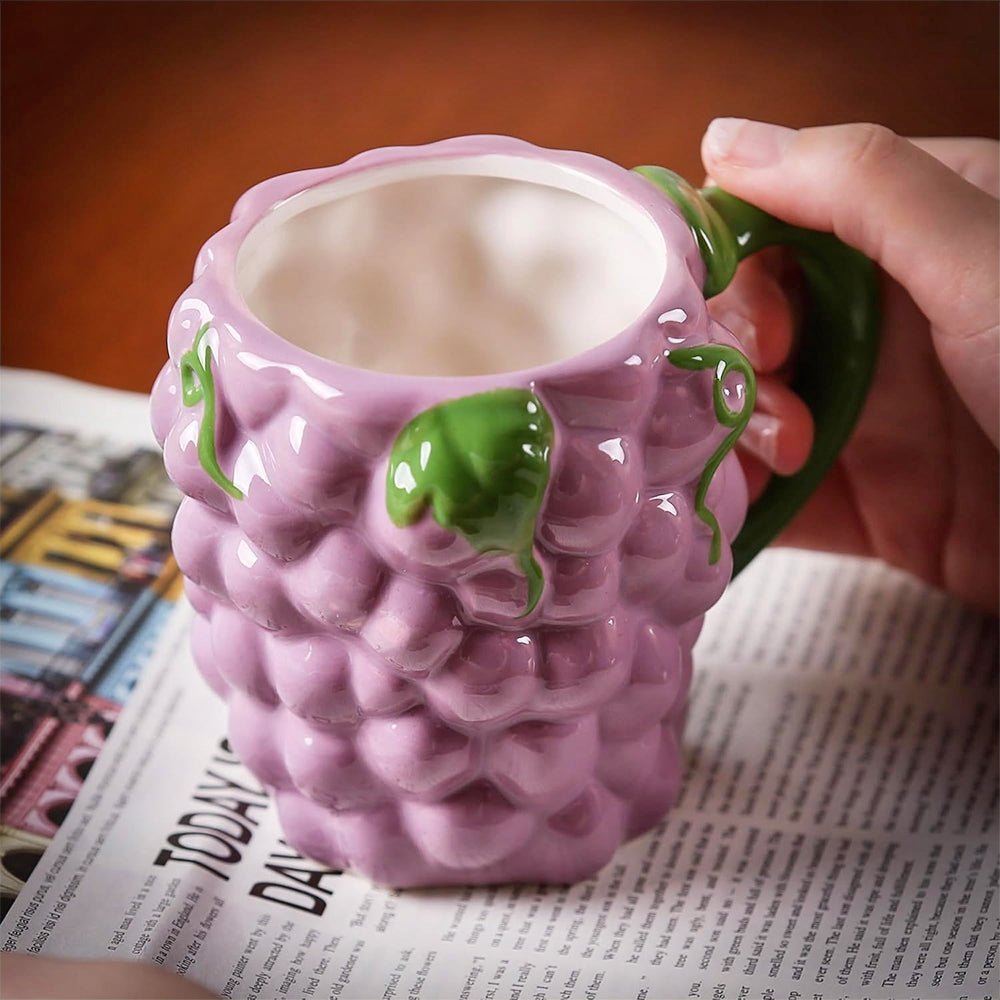 A unique coffee mug, grape shape, featuring a detailed design and ergonomic handle, made of premium ceramic.