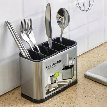 Stainless steel utensil holder for countertops with compartments organizing forks, knives, spoons, and chopsticks in kitchen.