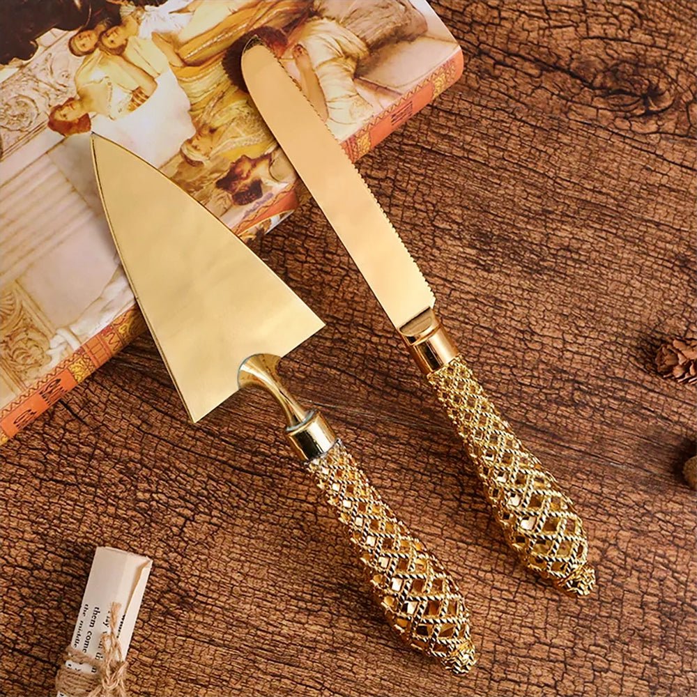 Elegant wedding cake server and knife set with intricate gold details. Ideal for special occasions.